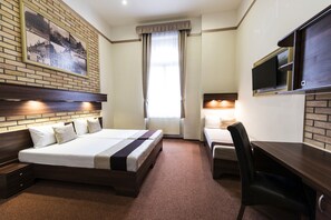 Triple Room | Minibar, in-room safe, desk, iron/ironing board