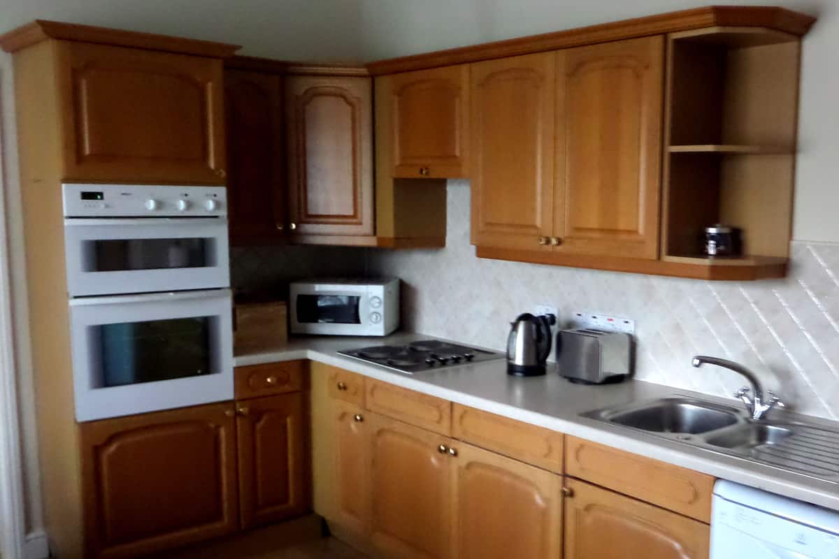 coffee/tea maker, electric kettle, toaster, dining tables