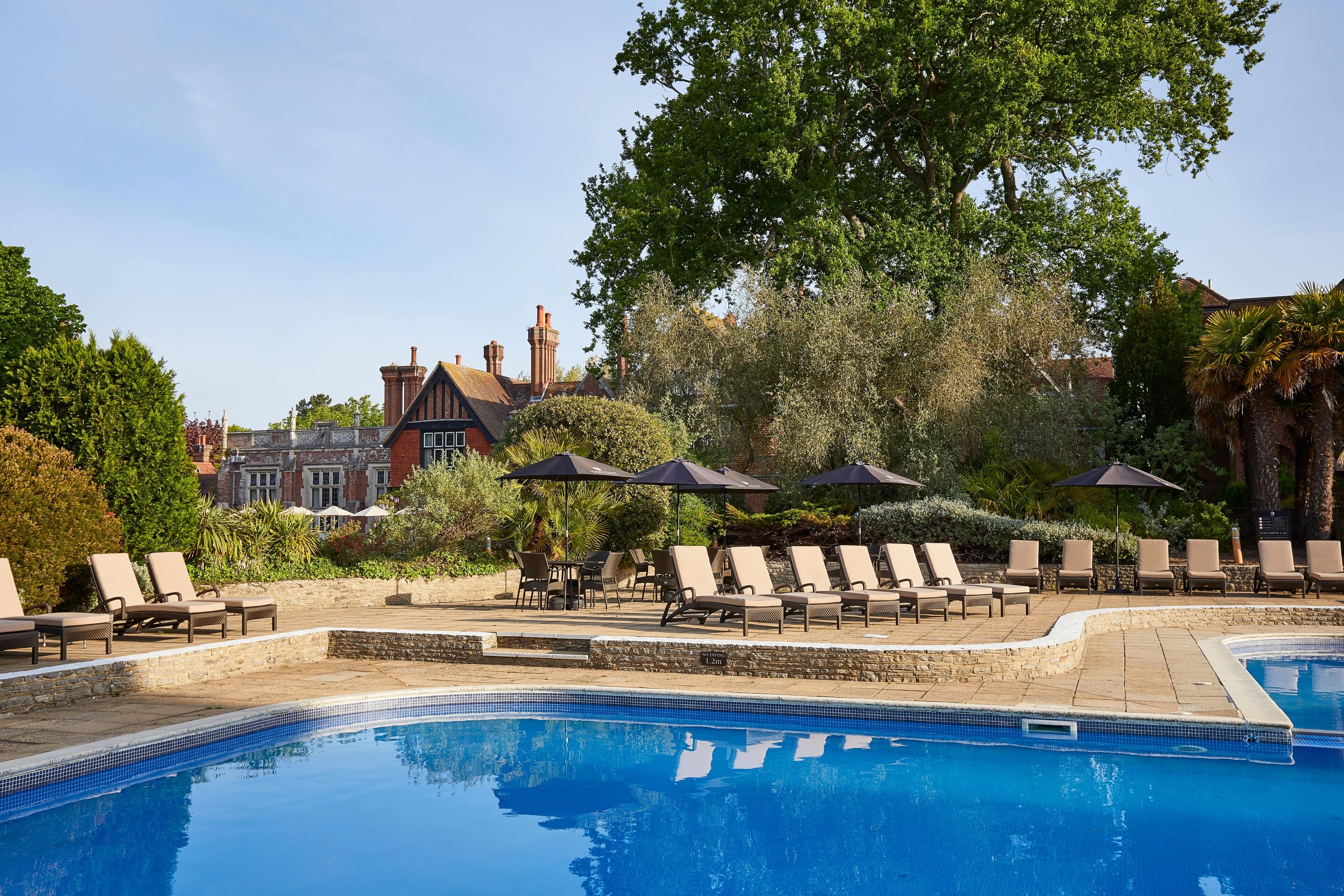 indoor pool, outdoor pool, open 10:00 am to 8:00 pm, pool loungers