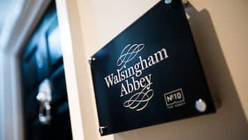 A sign with the text "Walsingham Abbey" and "N°10" indicating a specific location or room number.