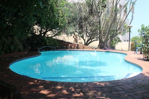 Outdoor pool, pool umbrellas, sun loungers