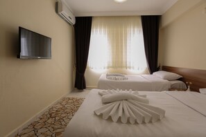 Standard Twin Room, 2 Twin Beds | Minibar, in-room safe, desk, iron/ironing board - Gizem Pansiyon (Çanakkale)
