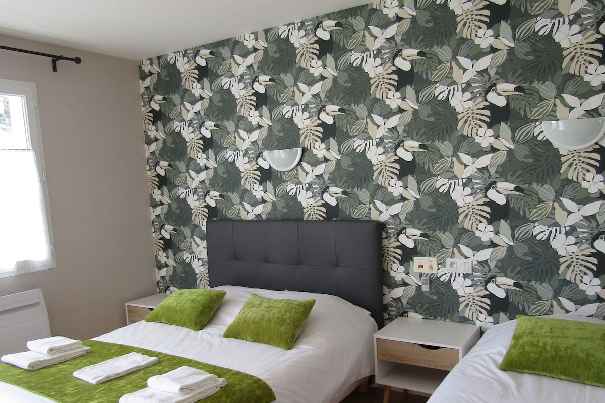 family triple room, multiple beds | premium bedding, desk, blackout curtains, iron/ironing board