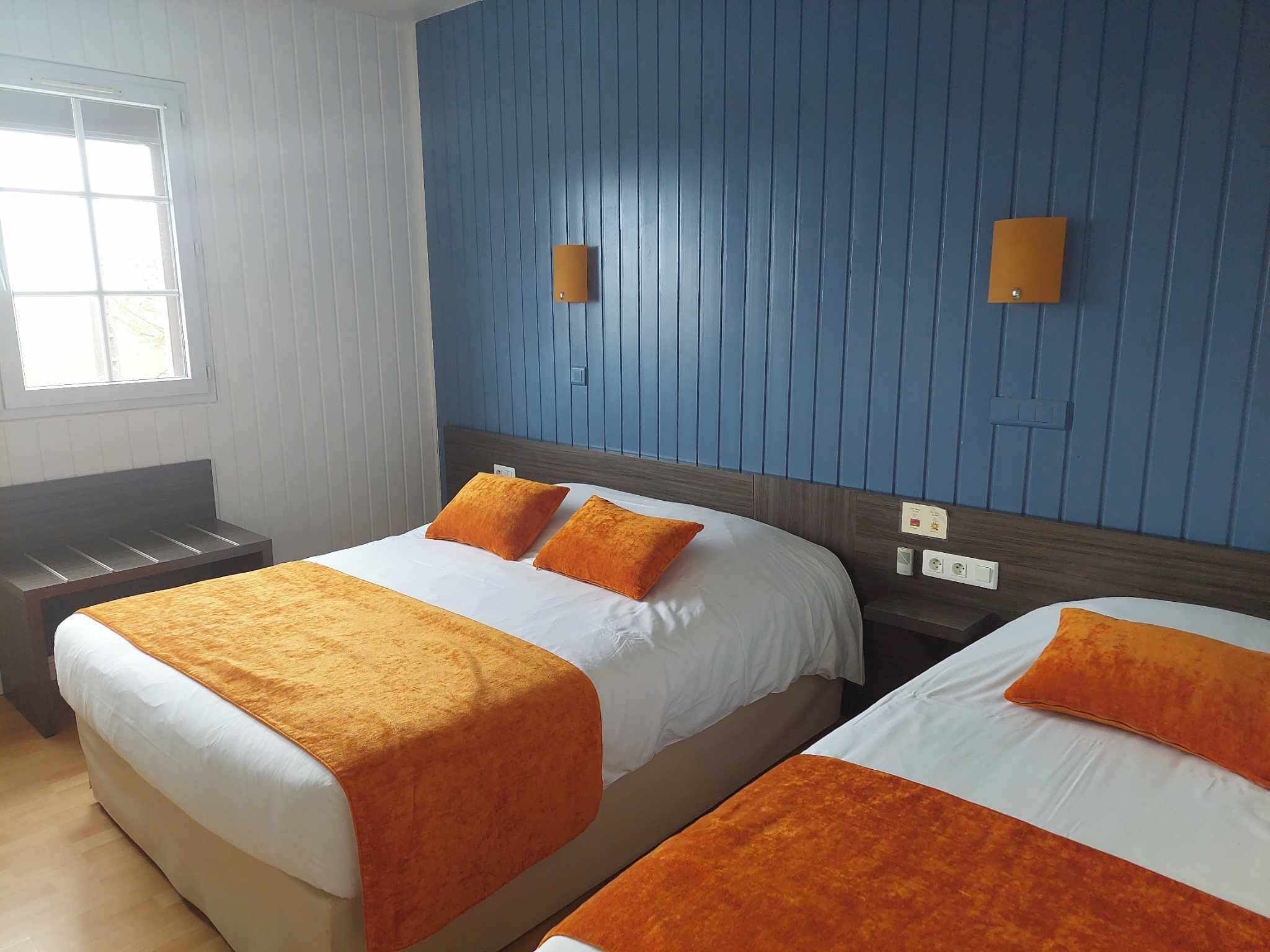 family triple room, multiple beds | premium bedding, desk, blackout curtains, iron/ironing board