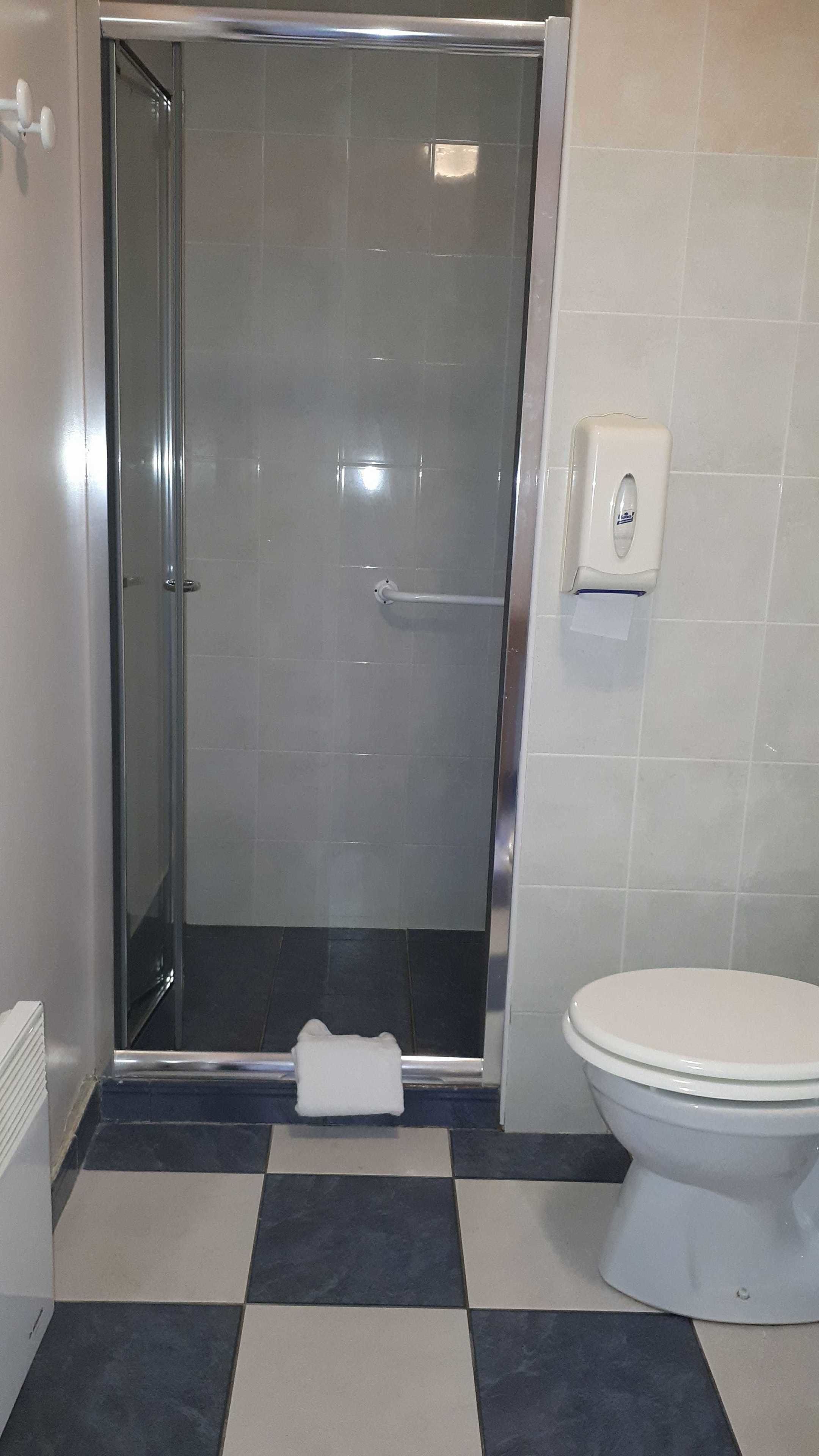 family triple room, multiple beds | bathroom | free toiletries, hair dryer, towels
