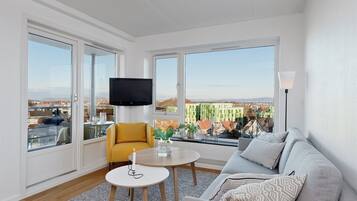 Panoramic Apartment, 2 Bedrooms, Balcony, City View | Living room | Flat-screen TV