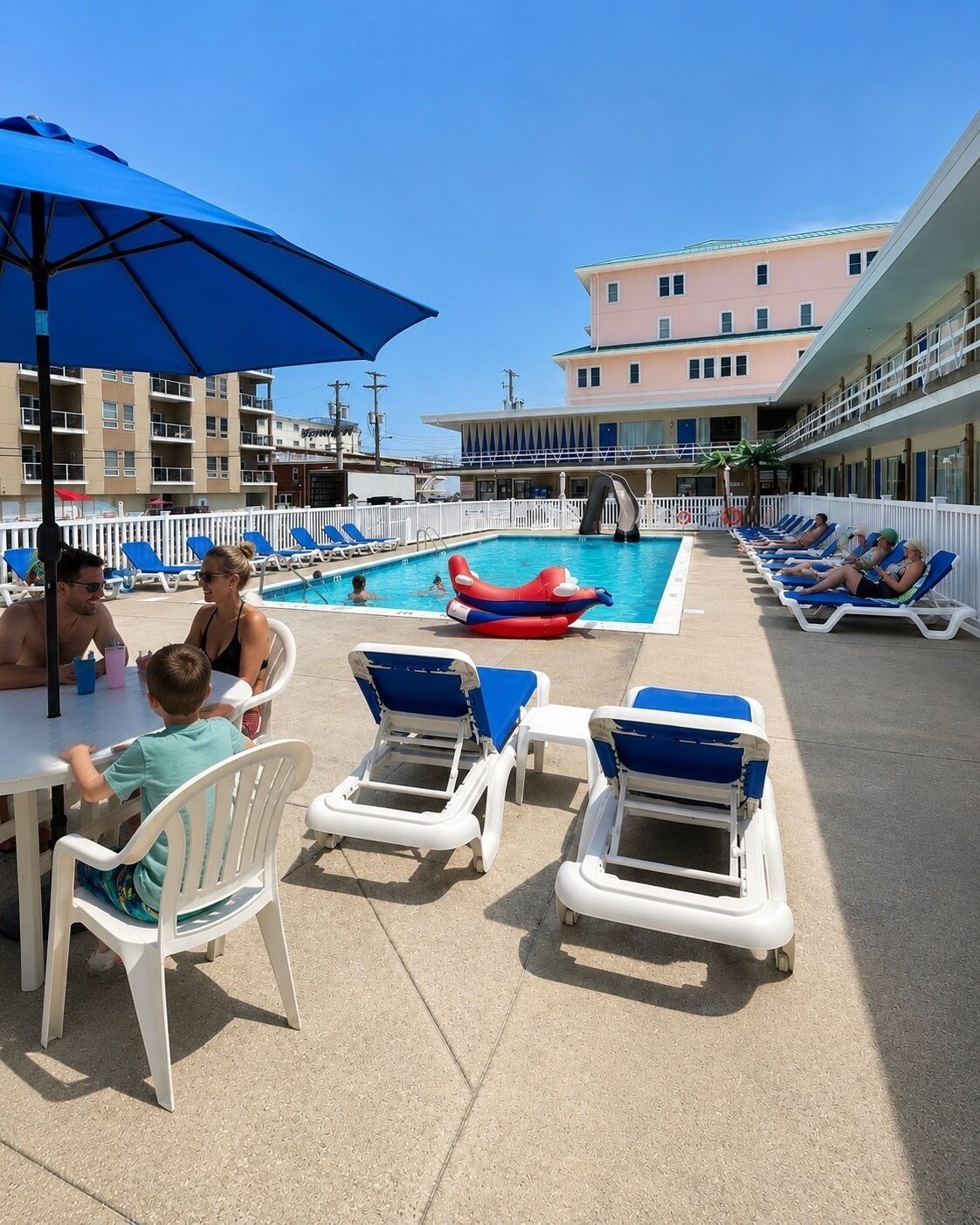 Seasonal outdoor pool, open 10:00 AM to 7:00 PM, pool umbrellas