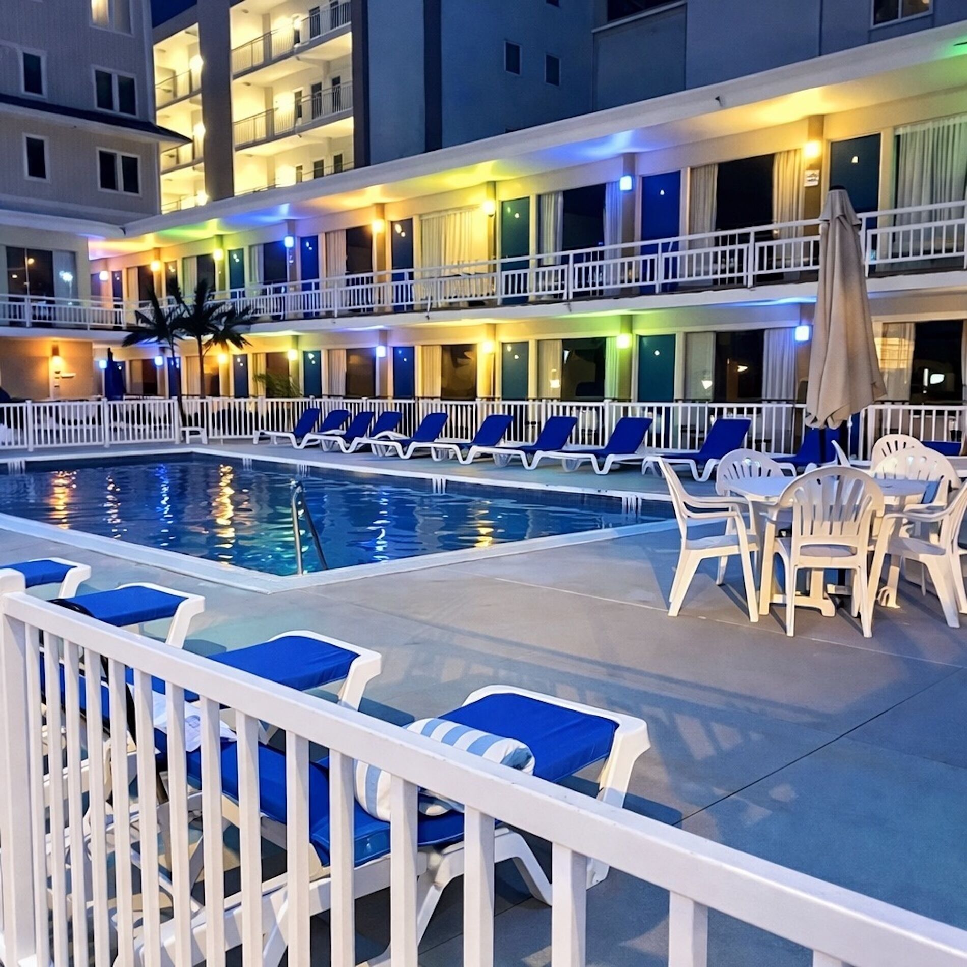 Seasonal outdoor pool, open 10:00 AM to 7:00 PM, pool umbrellas