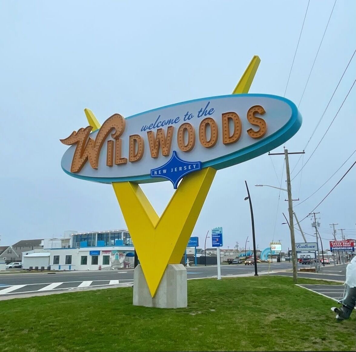 A sign with 'Welcome to the Wildwoods' and 'New Jersey' text.