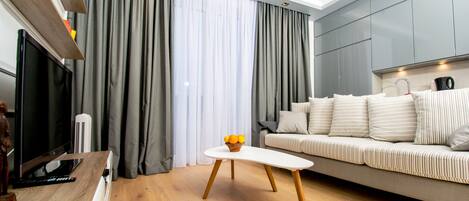 Superior Apartment, 1 Bedroom, Non Smoking, Kitchenette | Living room | Flat-screen TV