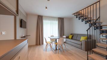 Comfort Duplex | Living area | Flat-screen TV