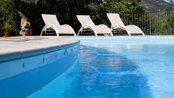 Seasonal outdoor pool, open 10:00 AM to 7:00 PM, sun loungers
