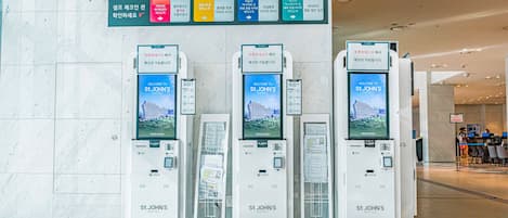 Three self-service kiosks at St. John's Hotel.