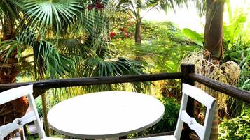 Economy Suite, 1 Bedroom, Microwave, Garden Area | Living area | 32-inch LED TV with cable channels, TV