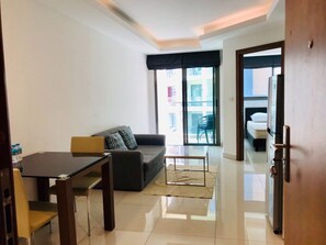 1 Bedroom Apartment | Living area | Flat-screen TV - Laguna Beach Resort 2 by PSR ASIA (Pattaya)