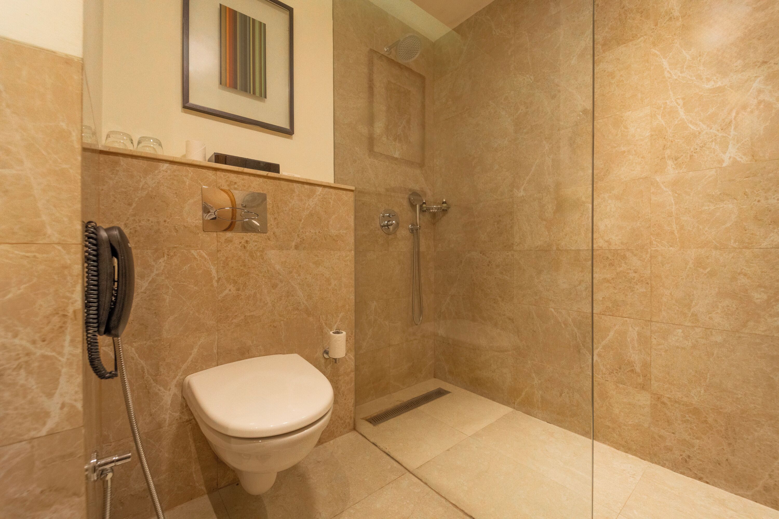 super deluxe room | bathroom | shower, rainfall showerhead, free toiletries, hair dryer