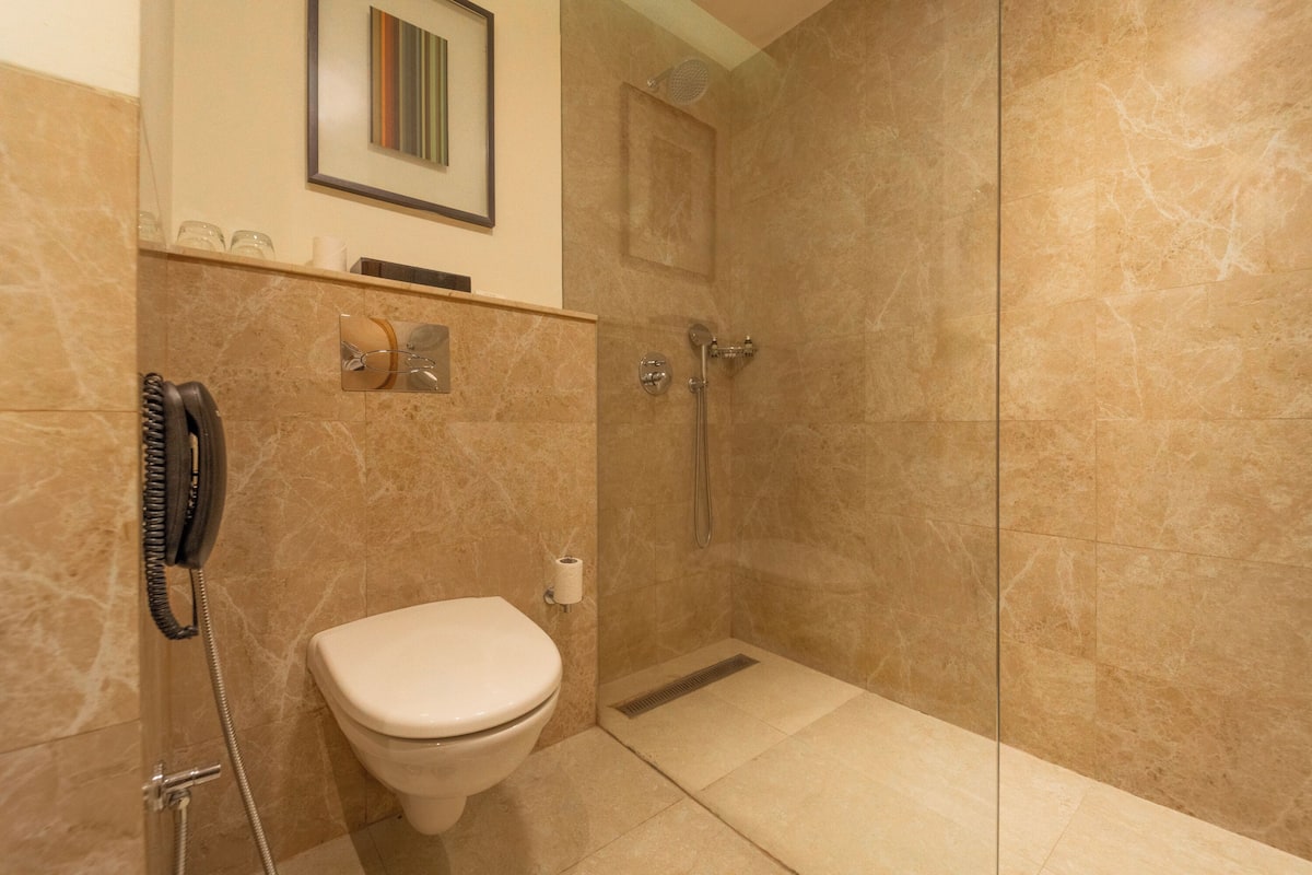 super deluxe room | bathroom | shower, rainfall showerhead, free toiletries, hair dryer