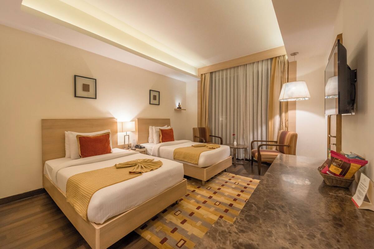 deluxe twin room | frette italian sheets, premium bedding, memory-foam beds, minibar