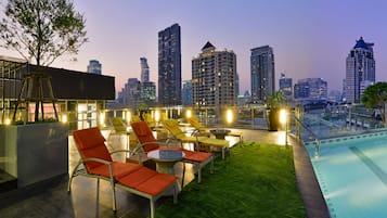 Outdoor pool, a rooftop pool, pool umbrellas