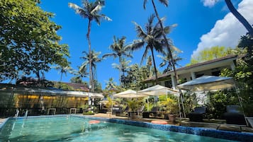 Outdoor pool, open 8:00 AM to 9:00 PM, free cabanas, pool umbrellas
