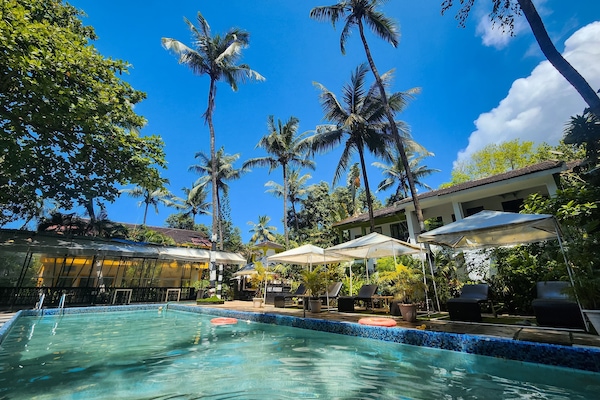 Outdoor pool, open 8:00 AM to 9:00 PM, free cabanas, pool umbrellas