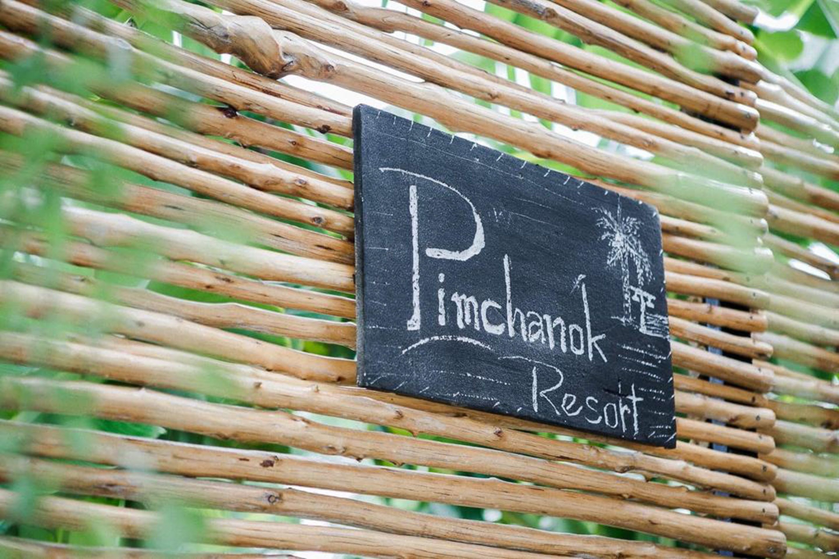A signboard with the text "Pinchanko Resort" on a black background.