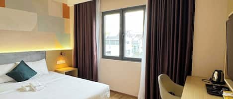 Superior kamer, 1 queensize bed | Luxe beddengoed, een minibar, individueel gemeubileerd