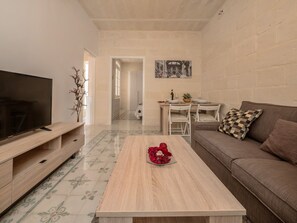 Family Apartment, 2 Bedrooms, City View | Living area | Flat-screen TV