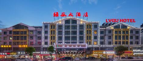 A hotel with multiple floors and a prominent sign.