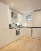 Apartment, 1 Bedroom, Kitchen | Private kitchen | Fridge, microwave, oven, stovetop