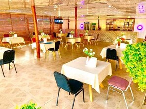 Breakfast, lunch, dinner served; local cuisine 