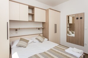Deluxe Apartment, 3 Bedrooms, Balcony, Sea View | Iron/ironing board, free cribs/infant beds, free WiFi, bed sheets