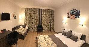 Family Suite | Desk, iron/ironing board, cribs/infant beds, free WiFi