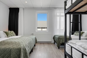 Family Room | Premium bedding, desk, blackout drapes, soundproofing