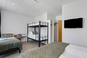 Family Room | Premium bedding, desk, blackout drapes, soundproofing