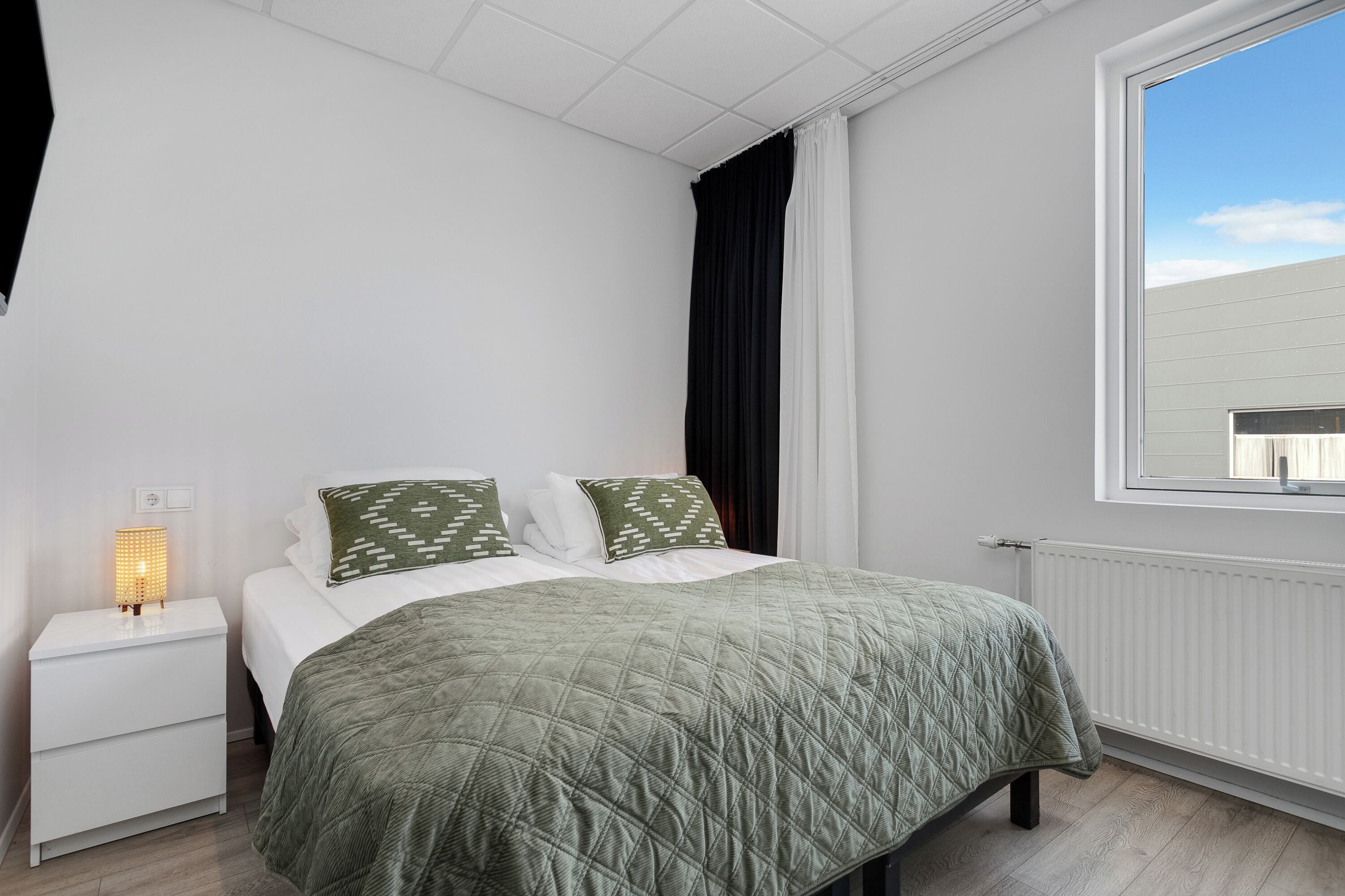 Family Room | Premium bedding, desk, blackout drapes, soundproofing