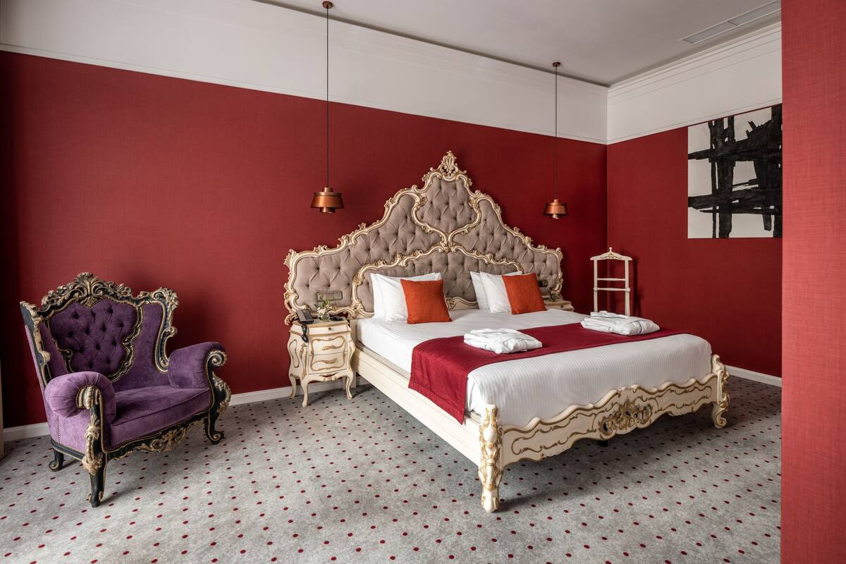 Suite ejecutiva, 1 cama de matrimonio grande, balcón | 1 dormitorio, ropa de cama de alta calidad, minibar y caja fuerte