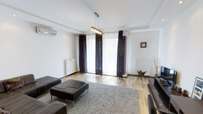 Apartemen, 2 kamar tidur | Area keluarga | TV layar datar