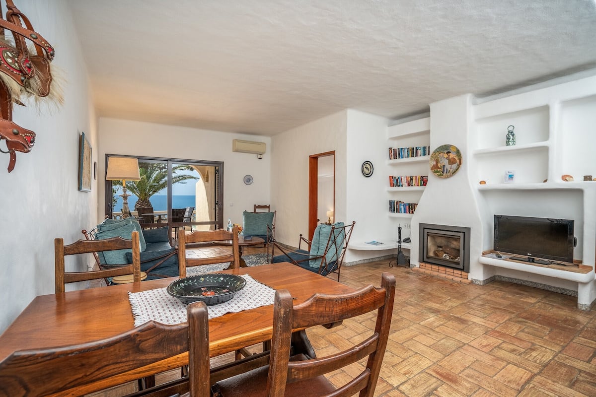 Bungalow, 2 Bedrooms, Sea View, Sea Facing | Living area | 80-cm LCD TV with satellite channels, TV, fireplace