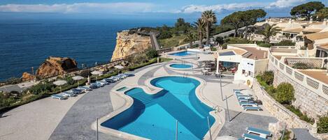 2 outdoor pools, open 9 AM to 7 PM, pool umbrellas, sun loungers