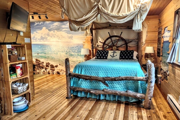Fun authentic driftwood bed, luxurious mattress & cool drop-down privacy canopy!