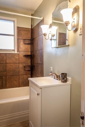 Combined shower/tub, hair dryer, towels, soap