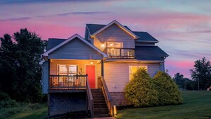 A two-story house with a front porch, a staircase, and a small front yard. - Bourbon Trails, Fishing and Relaxing - Taylorsville Lake has it all! (Taylorsville)