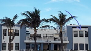 A building with a sign reading "SANDPIPER" and a balcony with railings. -  Gorgeous 360° Oceanfrnt Views* In the heart Famous Broadwlk*$Free Off St Park$* (Hollywood)