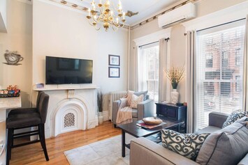 Living room with high ceilings, smart TV and remote controlled lights