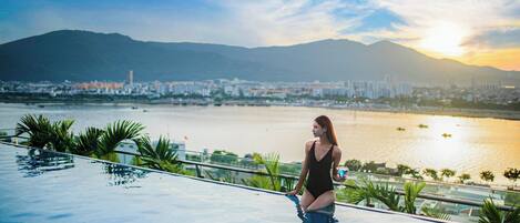 Outdoor pool, pool umbrellas, sun loungers
