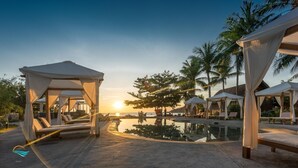 A resort with outdoor seating areas and a pool. - Casa Marina Resort (Quy Nhon Nam)