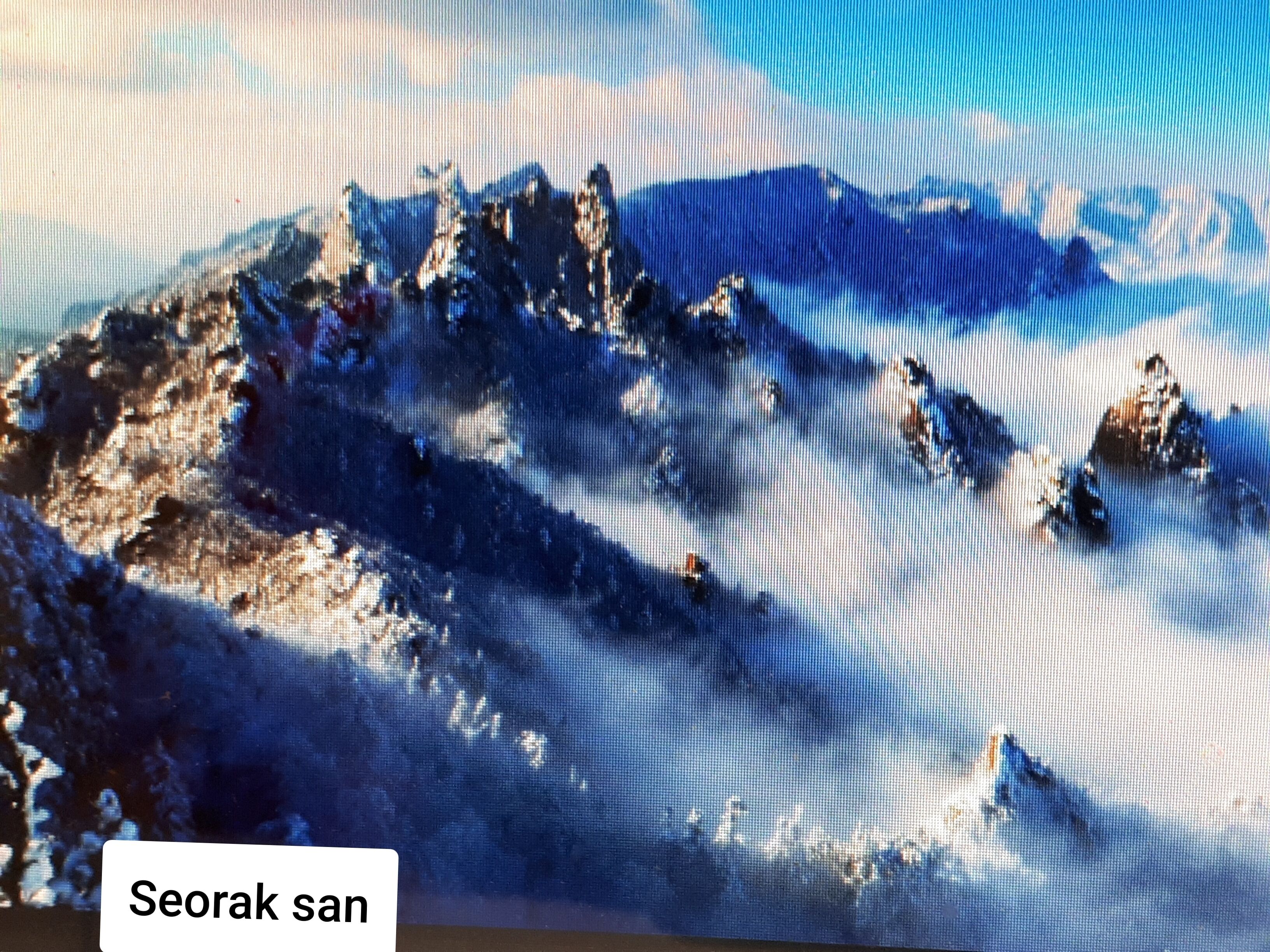 A mountainous landscape with a clear sky.