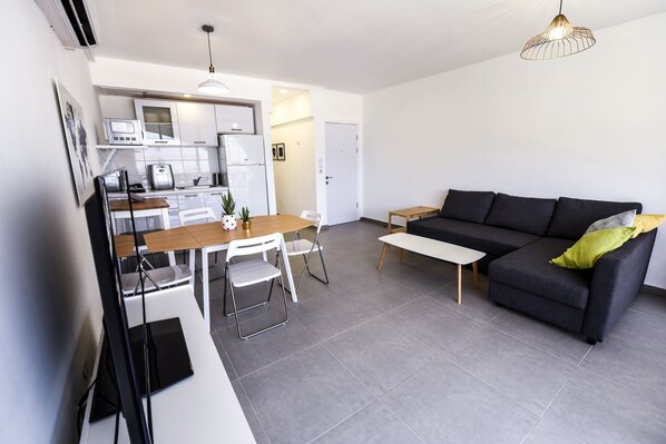 Apartment, 1 Bedroom, Sea View | Living area | Flat-screen TV