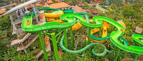 A water park with multiple slides and a viewing platform.